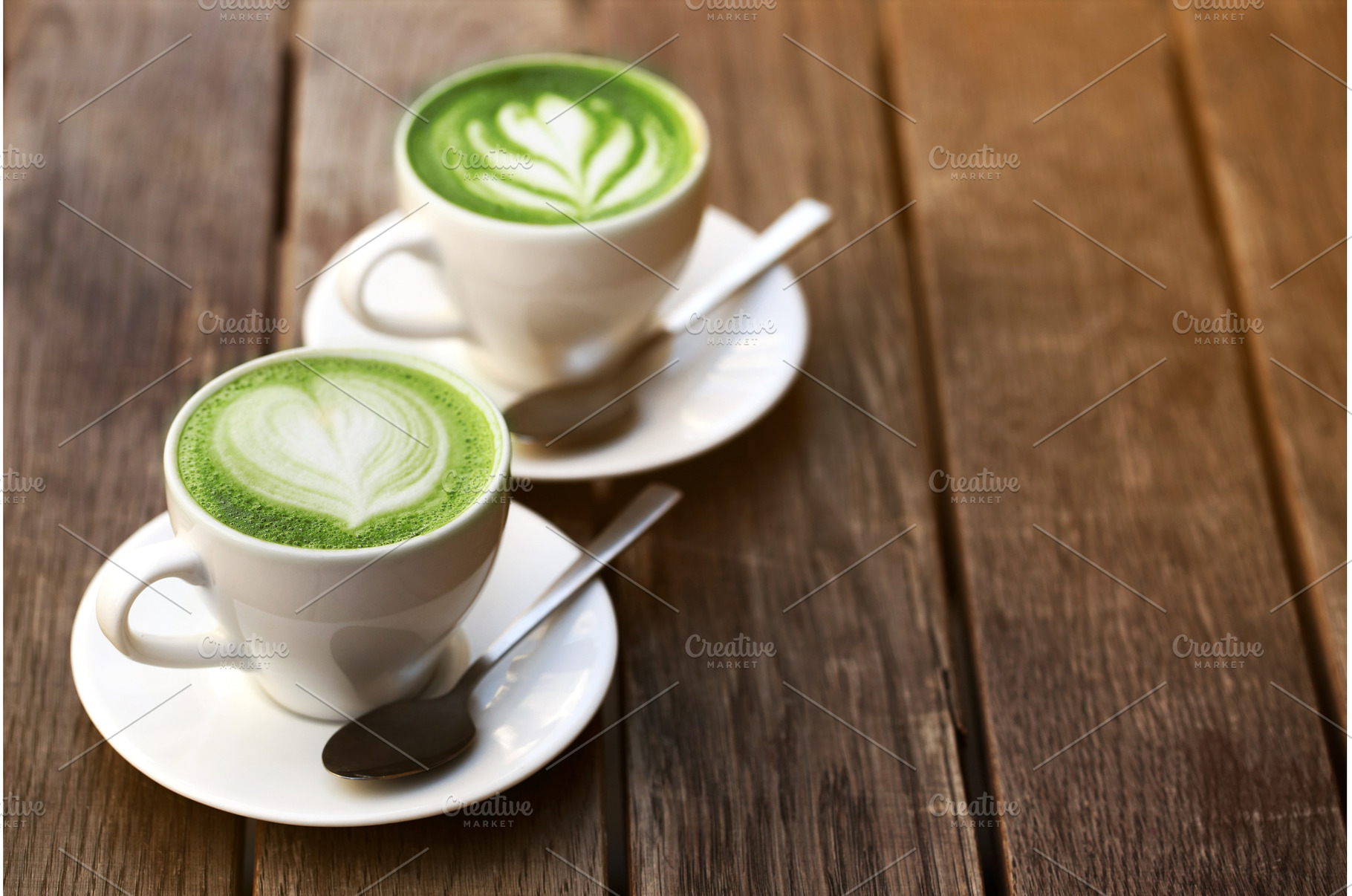 Two cups of matcha latte, a Food & Drink Photo by Anna Efetova