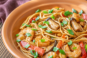 Asian stir fry udon noodles with prawns mushrooms vegetables in, a Food & Drink Photo by Alexander Prokopenko