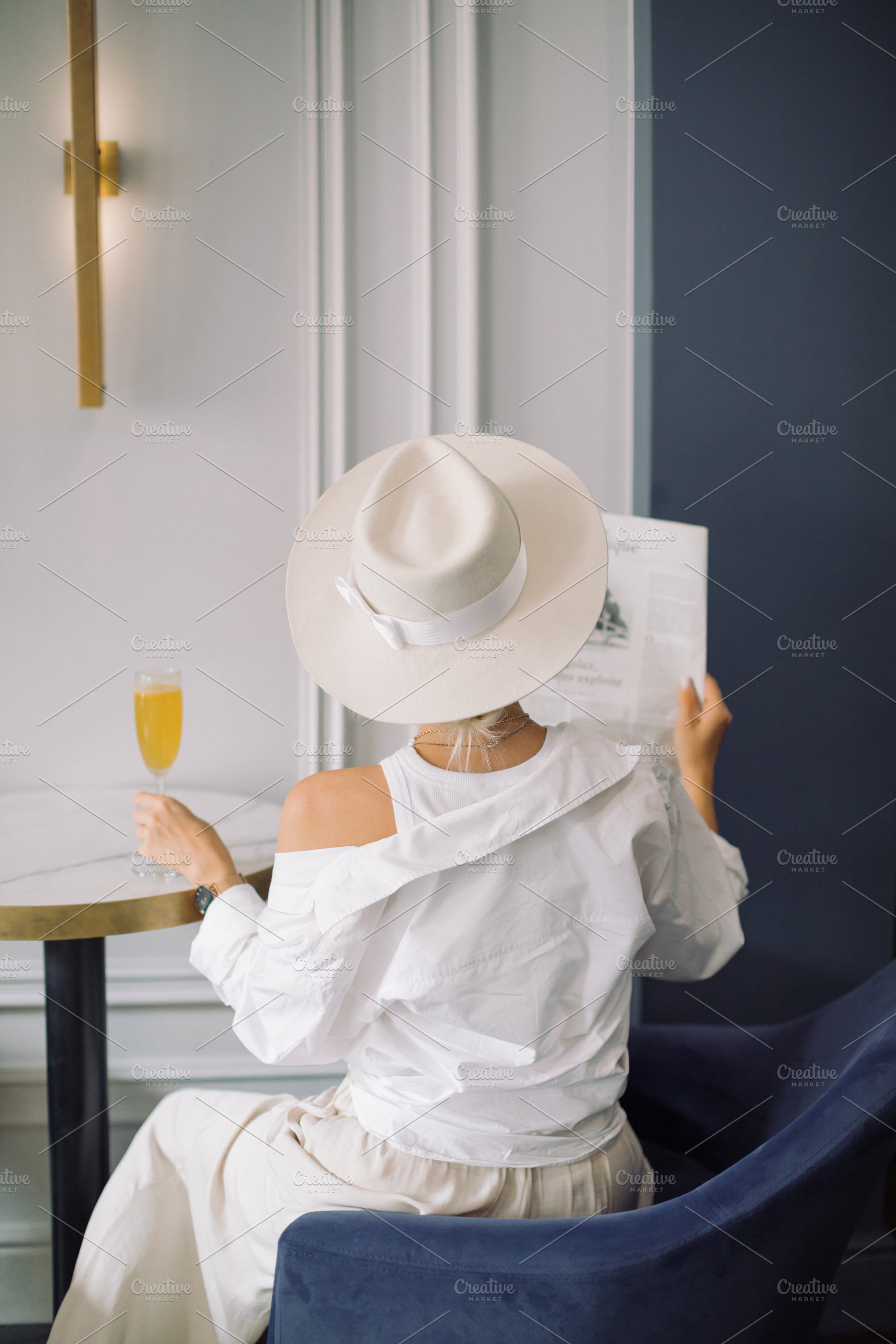 Elegant Woman in White Hat, a Photo by Nina Stock Photos