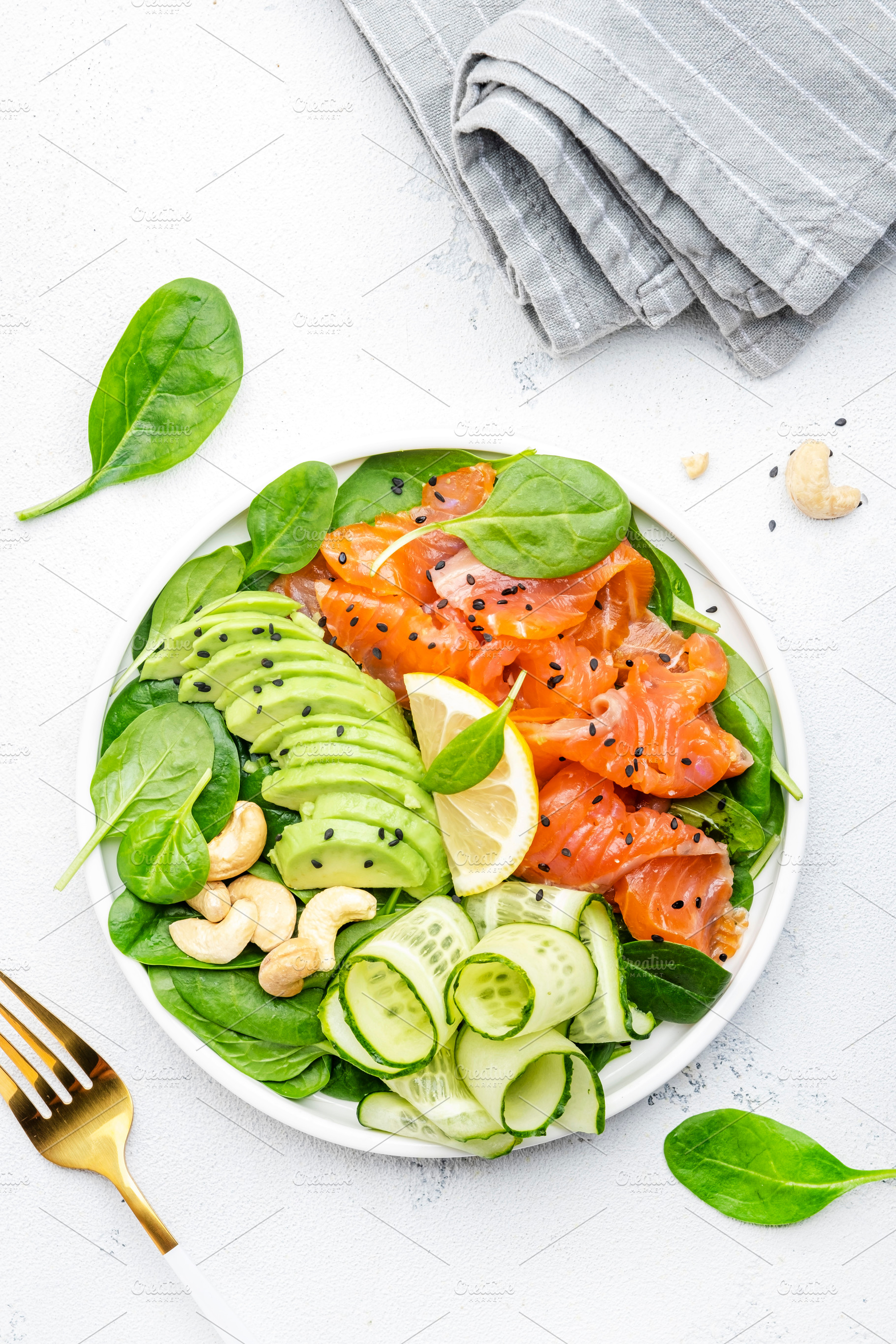 Salmon salad for ketogenic diet with avocado, spinach, cucumber,, a Food & Drink Photo by 5PH