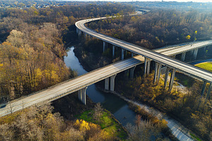 Top view photo of multilevel bridge highway road, an Industrial Photo by AlyaAnd