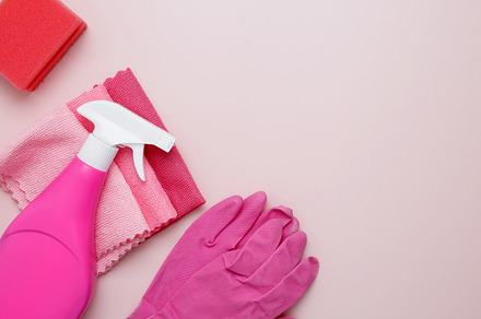 Household cleaning and hygiene concept. Pink cleaning supplies including rubber, a Photo by matucha