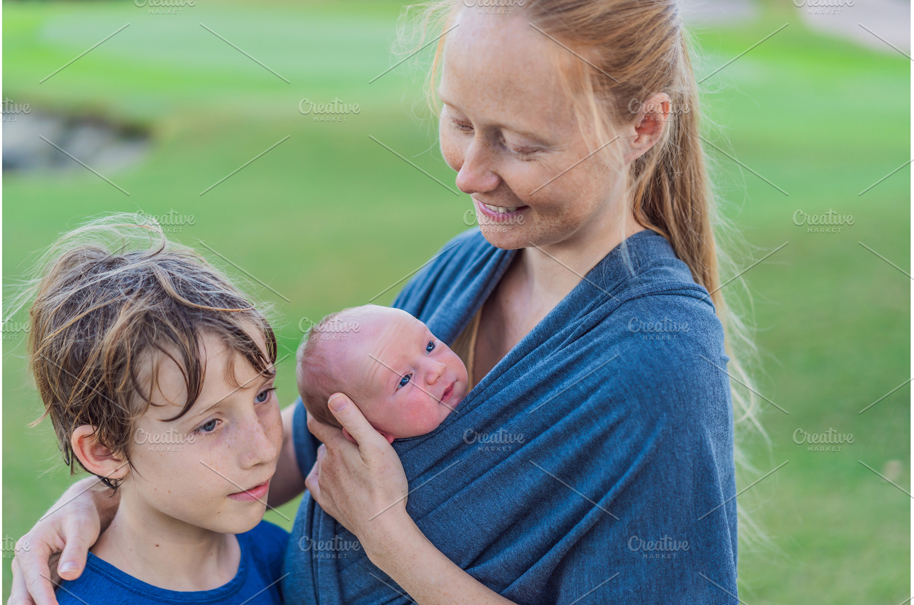 Mom walks with a newborn in a sling, a Person Photo by Elizaveta Galitskaya