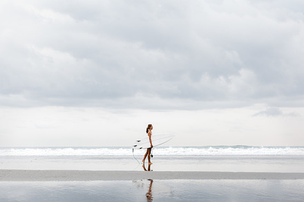 Sporty girl with her surfboard featuring background, woman, and beach, a Sports & Recreation Photo by Aliaksei Kaponia