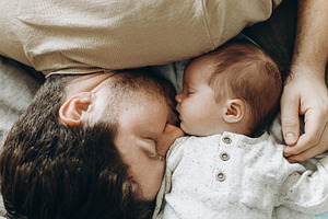 Happy Fathers day! Father sleeping together with little baby son, a Person Photo by Sonjachni