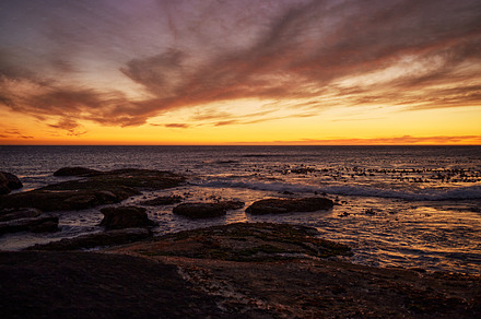 Sunset, beach and landscape of natural environment, ocean and sea during night in summer. Sky, nature earth and sunrise in horizon in a tropical, calm and location with peace in Thailand on an island, a Photo by Peopleimages.com