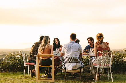 Group of young friends having dinner, a Person Photo by Jacob Lund