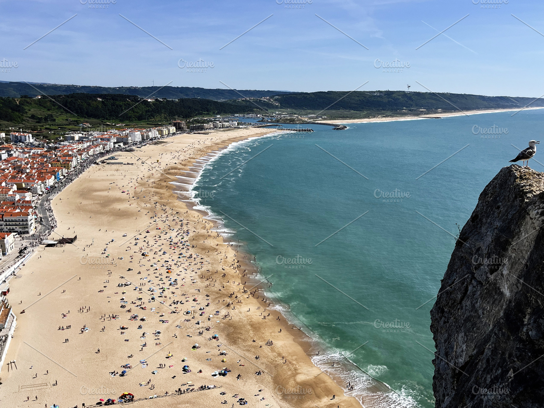 Scenic beach in Nazaré, Portugal with golden sands and ocean view, a Photo by AS photostudio