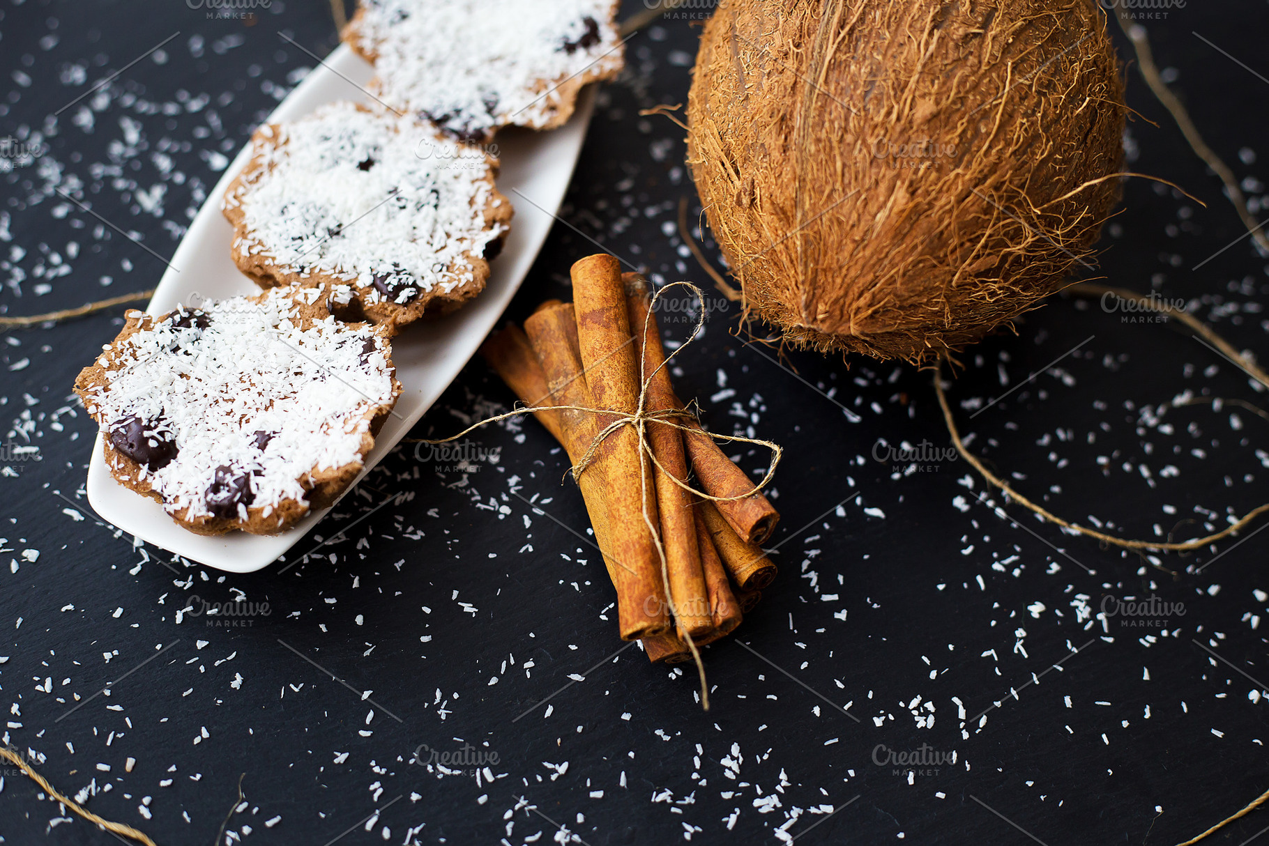 coconut muffins on a black background, a Food & Drink Photo by Artsaba Family