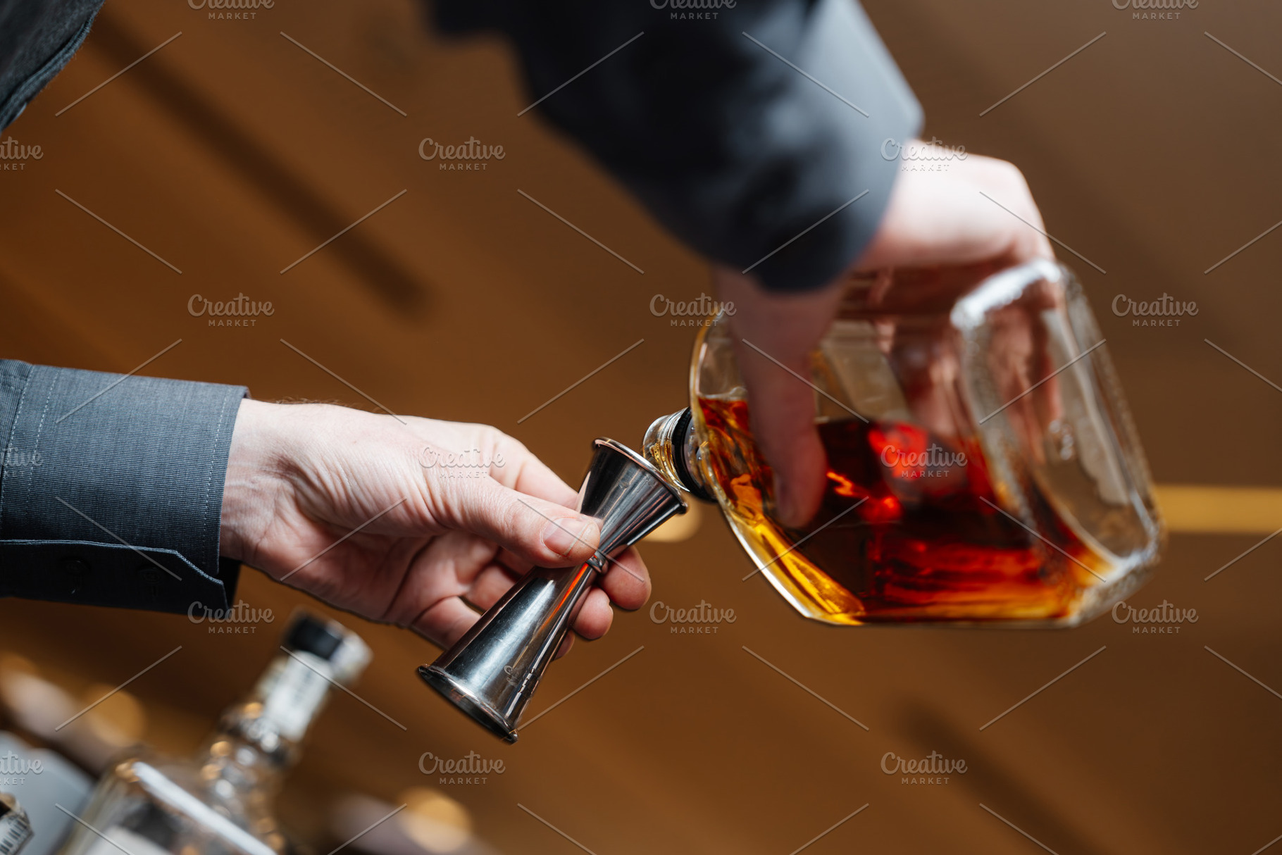Bartender pours whiskey for tasting., a Food & Drink Photo by Rov.7