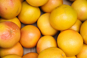 Fresh organic grapefruits offering healthy nutrition, abundant vitamins, and na, a Photo by Studio ANNA