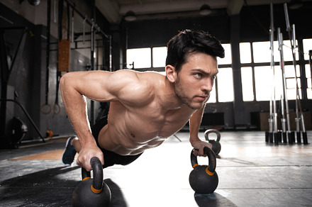 muscular man doing a pushups at gym, a Sports & Recreation Photo by OPOLJA