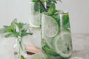 Summer drink with lime and mint. Cold drink, non-alcoholic mojit, a Food & Drink Photo by ndanko
