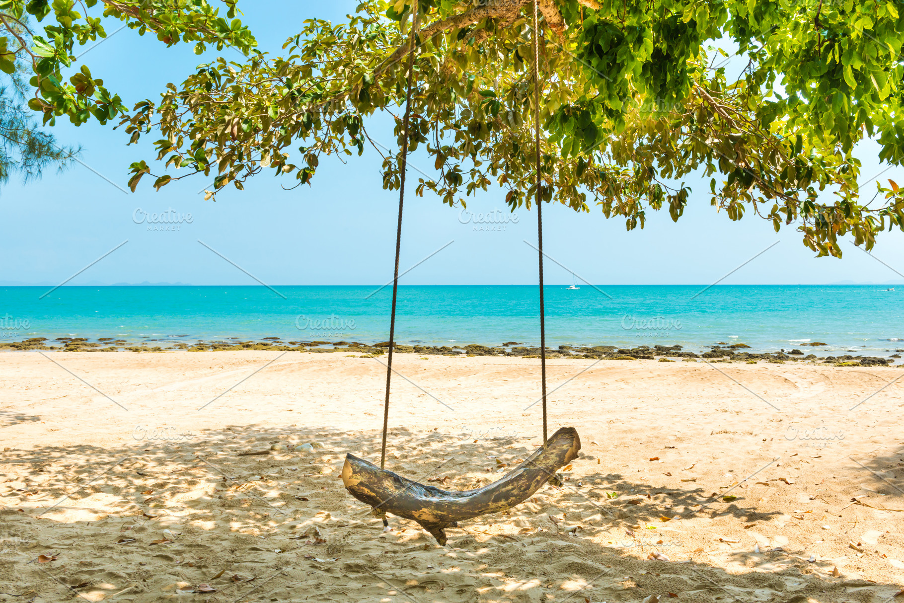 Swing on sand beach at tropical island, a Nature Photo by Vapi