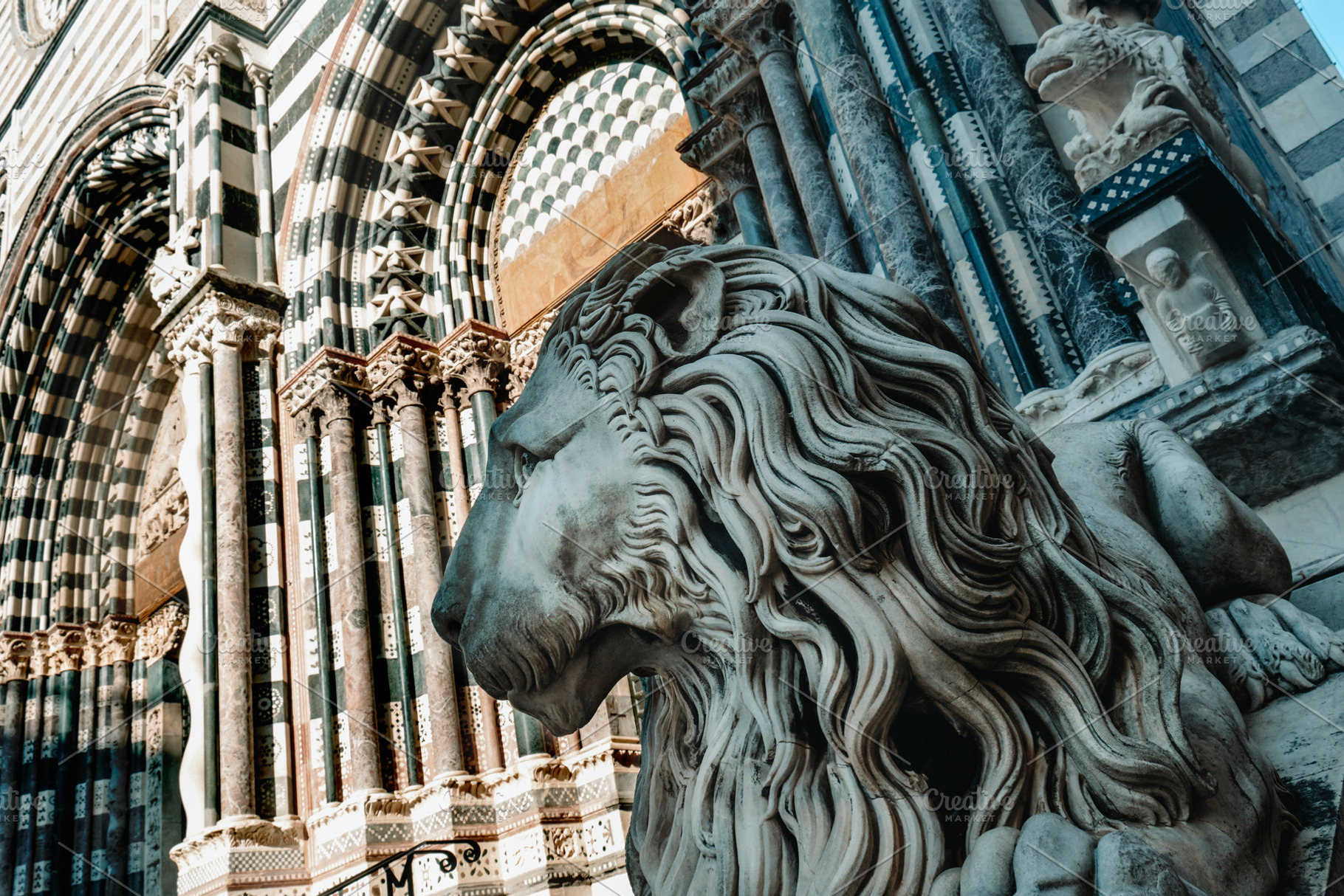 lion at the entrance of the Cathedral of Genoa, a Photo by Nito