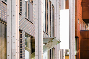 Shop signage on modern building wall, a Business Photo by BOOCYS