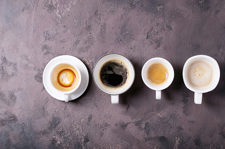 Fresh coffee in cups containing arabian, black coffee, and roast