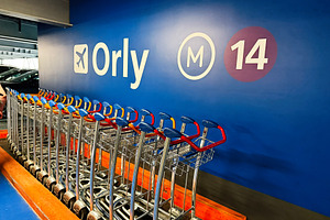 Row of airport luggage trolleys at Orly parking terminal M14 in Paris, France,, a Photo by AS photostudio