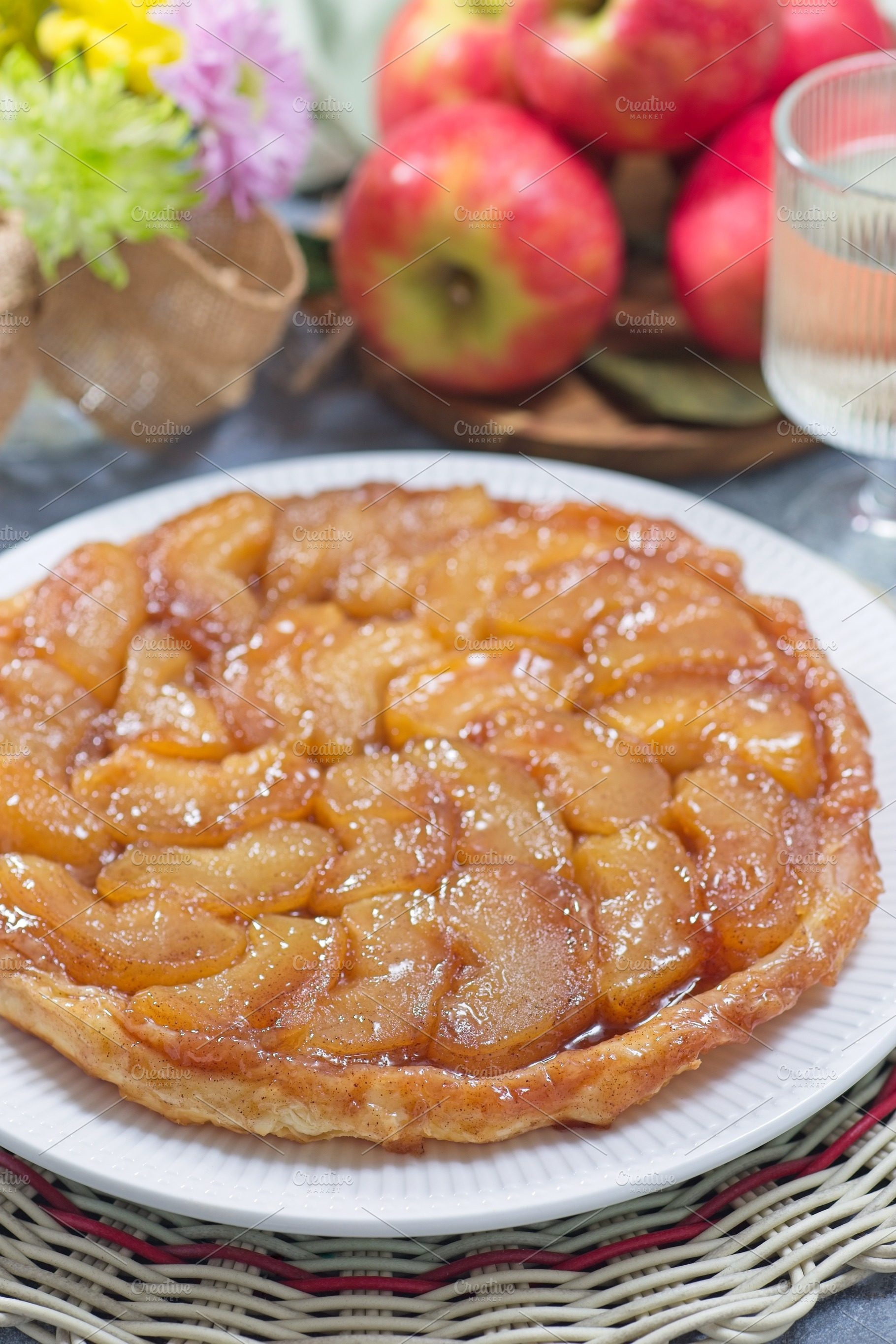 Apple Tart Tartin on plate closeup, french upside down cake, vertical, a Food & Drink Photo by iuliia_n