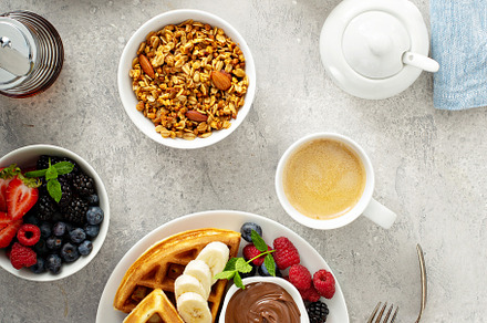 Waffles with berries and chocolate for breakfast, a Food & Drink Photo by farwasser