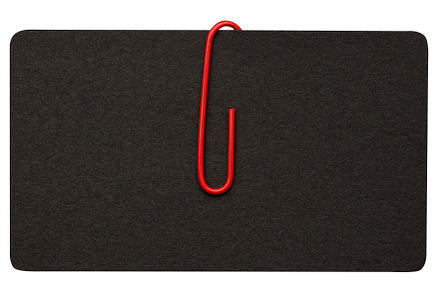 Black paper cardboard business card and red metal paper clip on, a Business Photo by ndanko