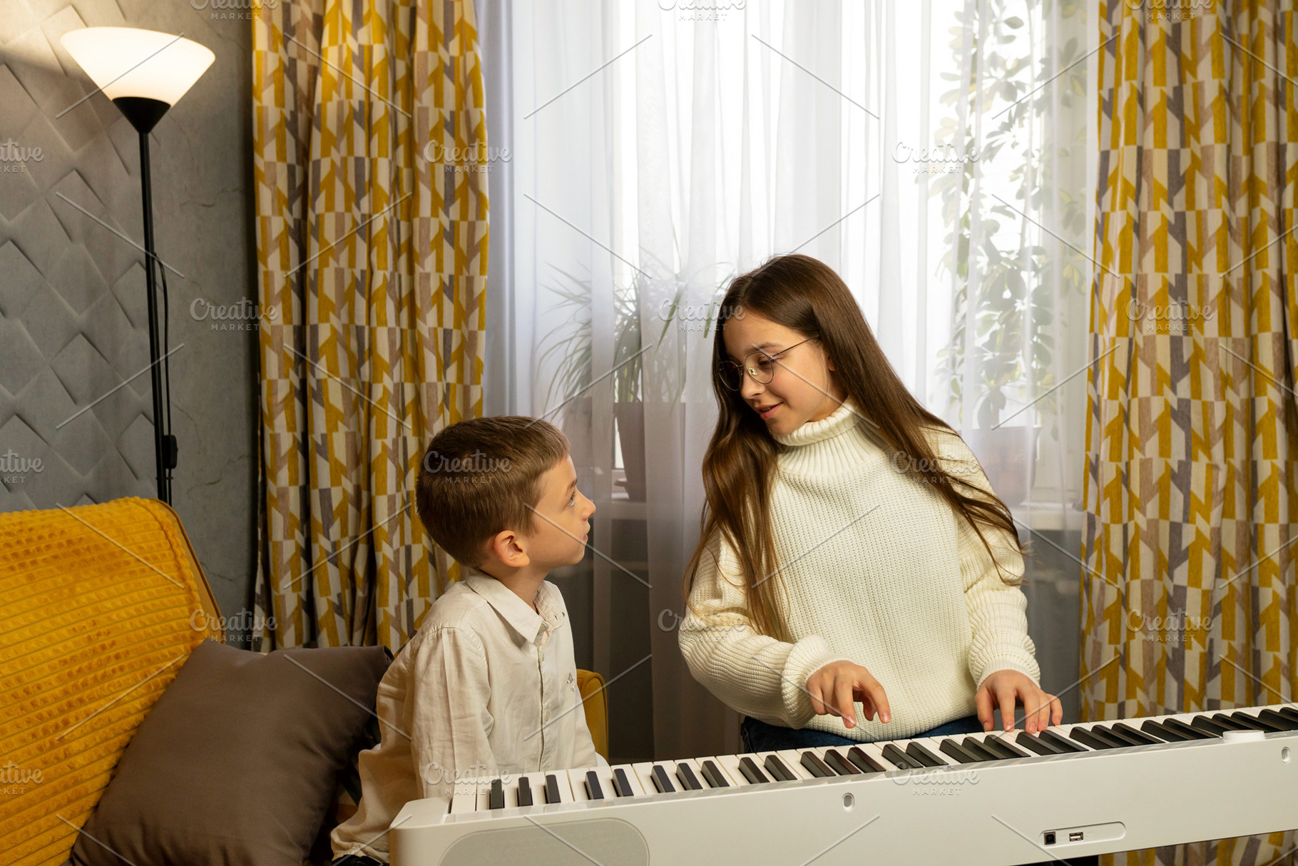 Girl in glasses plays digital piano, a School & Education Photo by Elena Vagengeim
