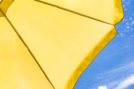 Yellow beach umbrella, an Abstract Photo by KYNA STUDIO