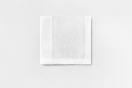 squared white paper pouch, a Photo by UN-BRANDED