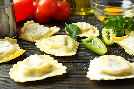 Concept of cooking ravioli on wooden background, a Food & Drink Photo by AtlasStudio PRO