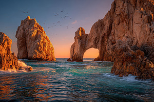 Sunset at El Arco Cabo San Lucas roc, an Abstract Photo by Pixeness Studio