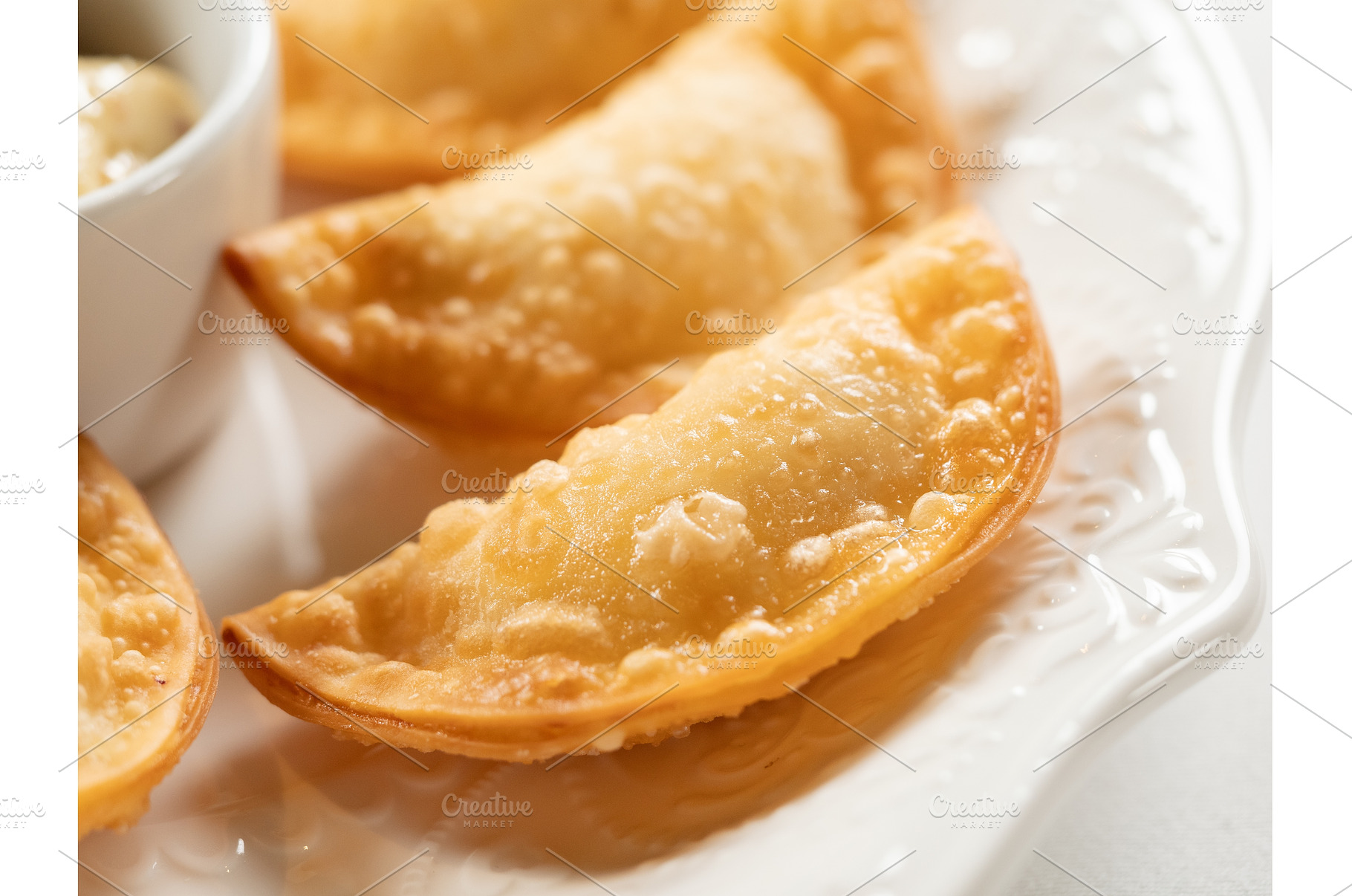 Mini Chebureki with sauces on white, a Food & Drink Photo by Fascinadora
