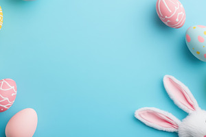 Easter decor on blue backdrop, a Photo by Beautiful things