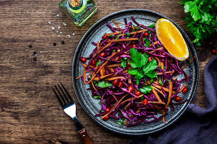 Coleslaw red cabbage salad with carrot, parsley, pomegranate and, a Food & Drink Photo by 5PH
