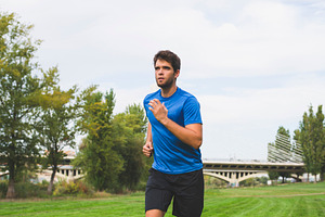 Bearded man dressed in sportswear ru containing man, young, and running