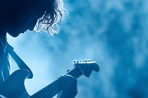 Silhouette of a guitarist playing, an Arts & Entertainment Photo by MistyDay