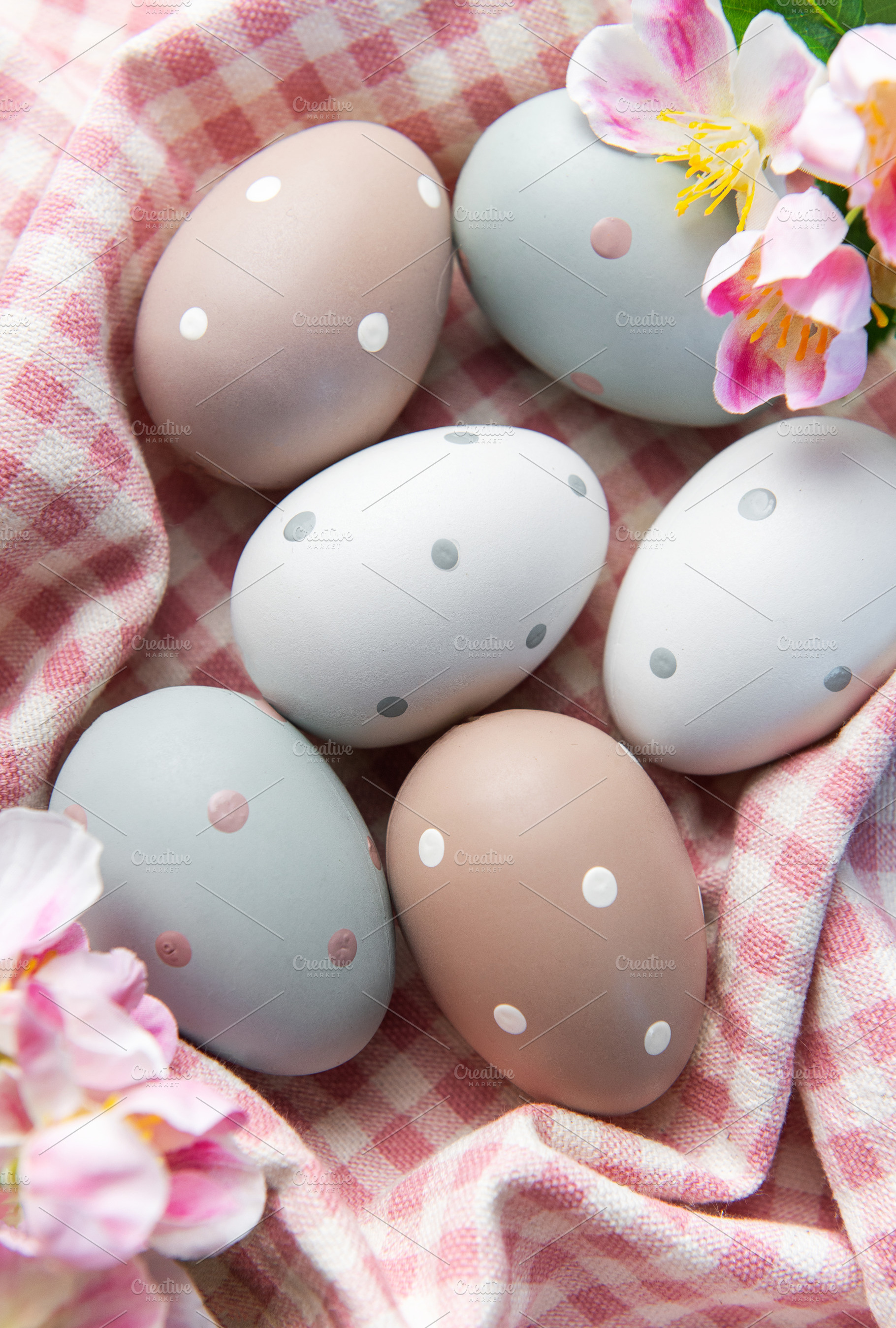 Pastel polka dot easter eggs in checkered basket, a Holiday Photo by Olena Rudo