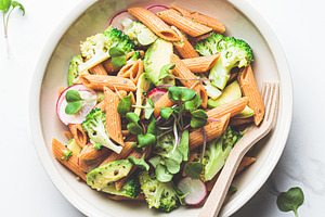 Lentil pasta with broccoli, avocado