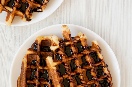Yummy Homemade Belgian Sugar Waffles on a white plate on a white, a Food & Drink Photo by LiudmylaChuhunova
