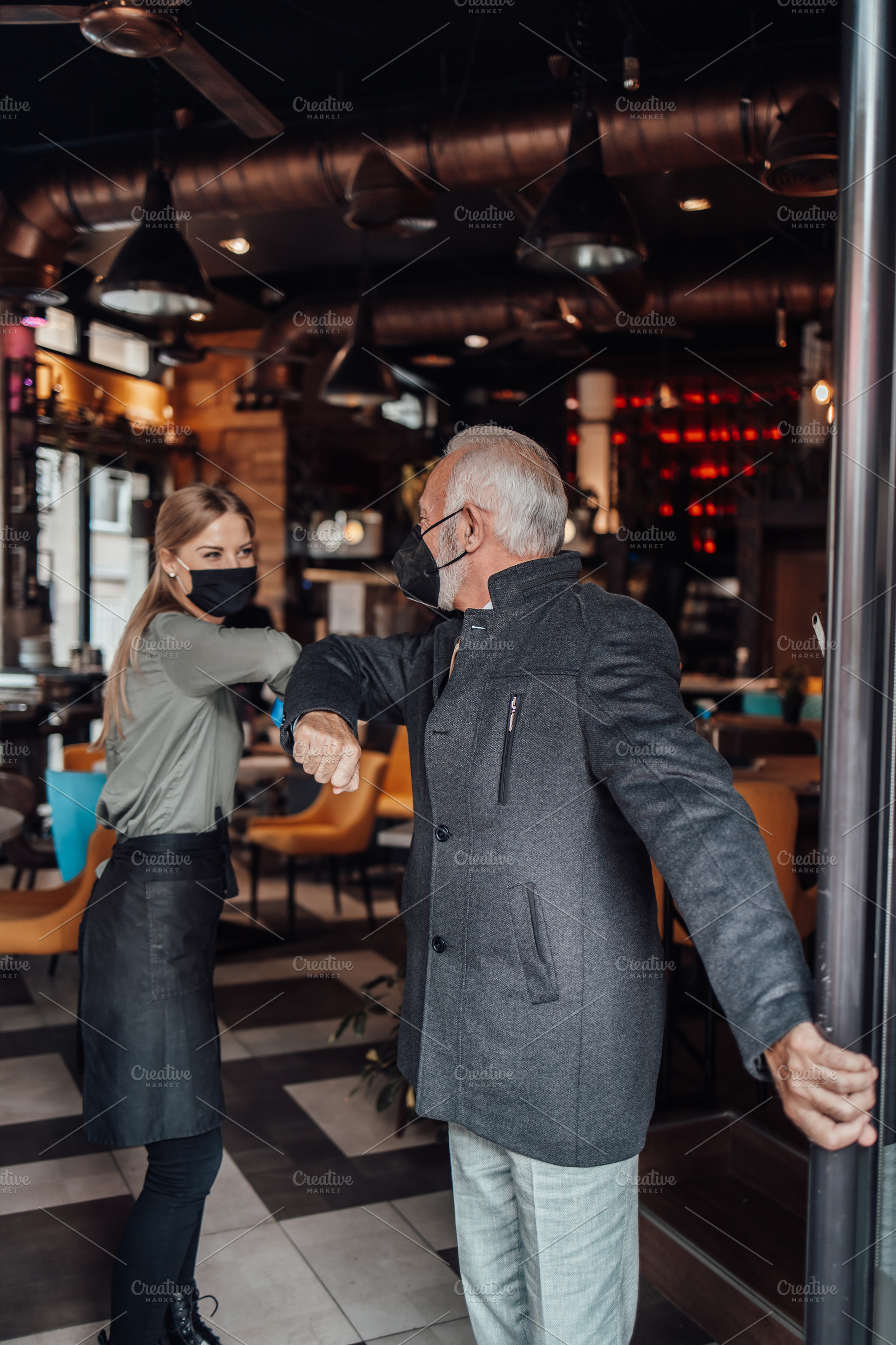 Senior businessman in a restaurant, a Person Photo by REDDOT Studio