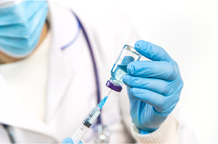 Doctor filling syringe with, a Health & Medical Photo by yanadjana