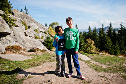 Brothers hike in the mountains, children are walking along a mou, a Person Photo by AS photostudio