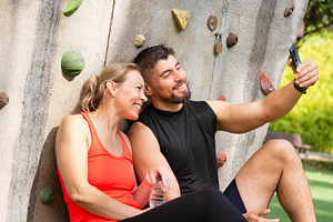 Happy fitness couple taking selfie after outdoor climbing workout, a Person Photo by etorres69