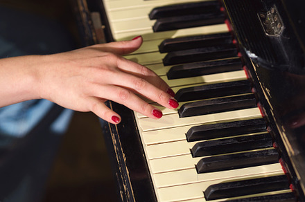 Woman hands on piano keys, an Arts & Entertainment Photo by Elena Vagengeim