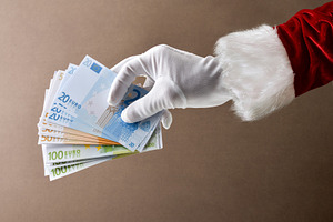 Santa Claus with pile of euro banknotes isolated on brown, a Holiday Photo by Davizro's Market