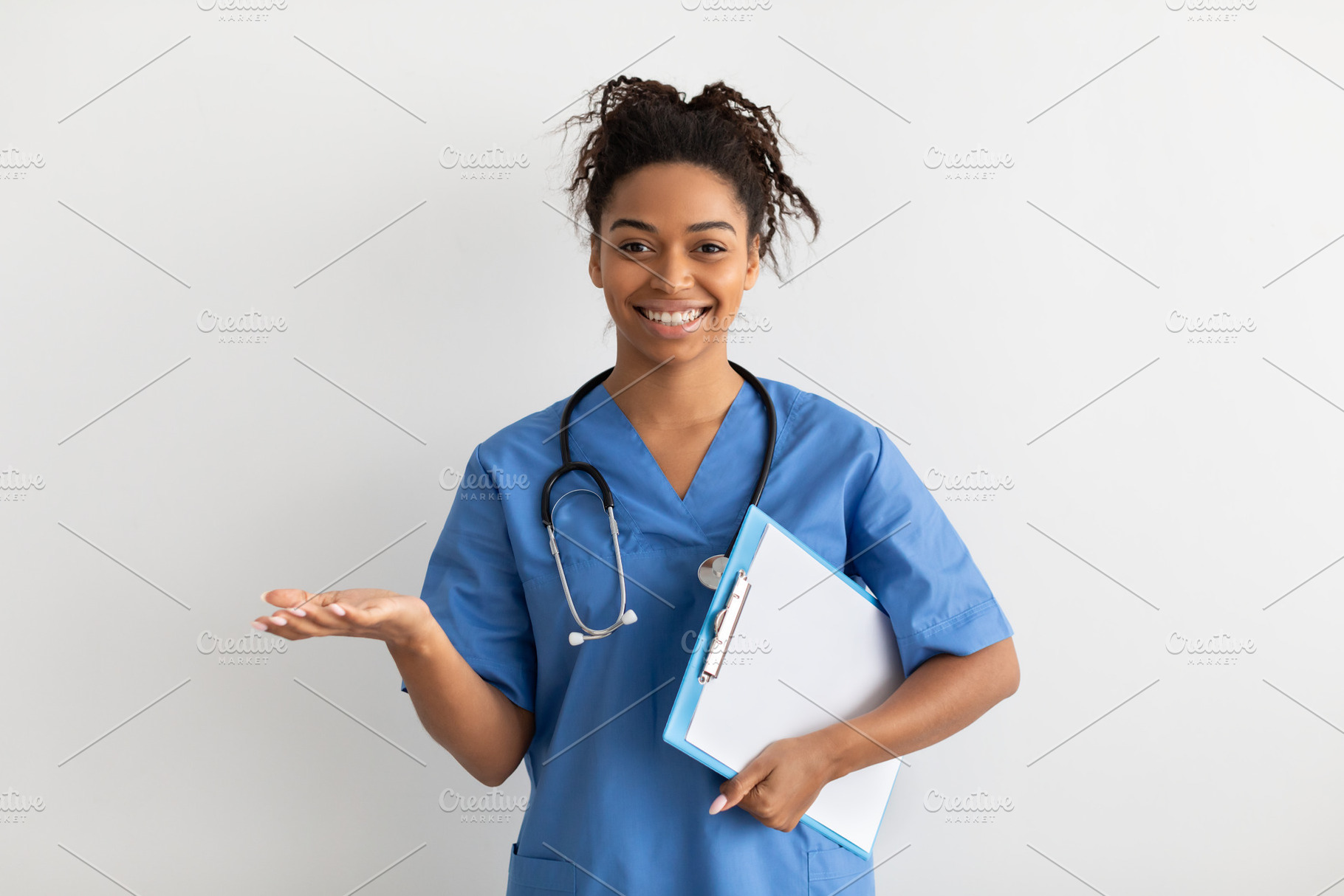 Portrait of black doctor smiling and posing to camera, a Photo by Prostock-Studio