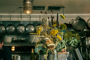 Old Flowers In A Restaurant