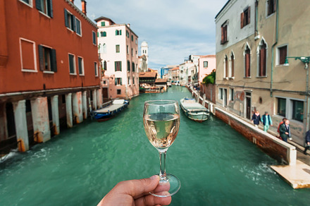 Drinking wine over Venice embankment