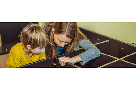 Mother and son assembling furniture, an Architecture Photo by Elizaveta Galitskaya