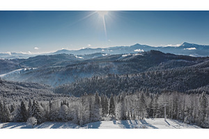Sun shining over snow covered, a Nature Photo by Goinyk