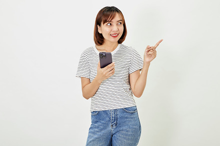 young asian woman smile happy use smart mobile phone, a Person Photo by 1981 Rustic studio kan